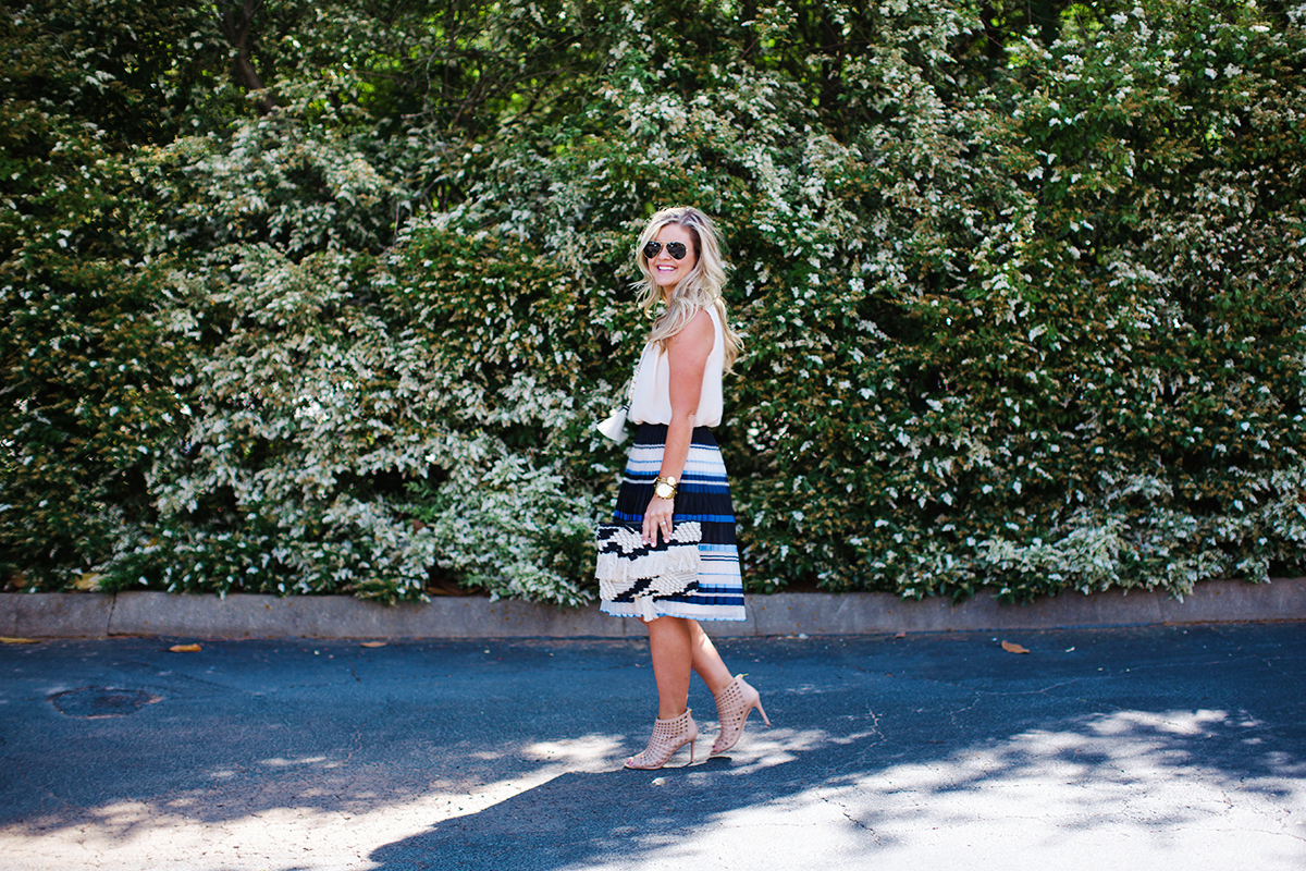 Striped skirt and sleeveless blouse outfit inspiration from Savvy Greenville