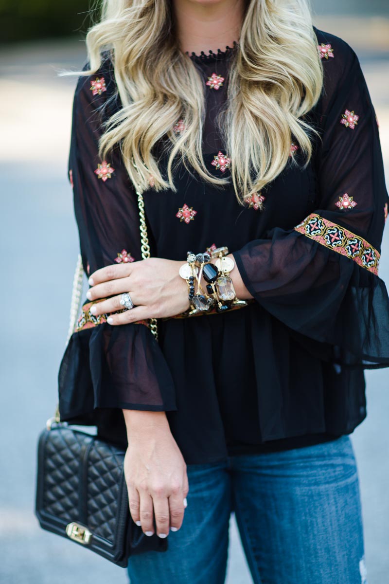 Black bell sleeve blouse with embellishment, fall outfit inspiration from Cristin Cooper of The Southern Style Guide, a top southern fashion blog.