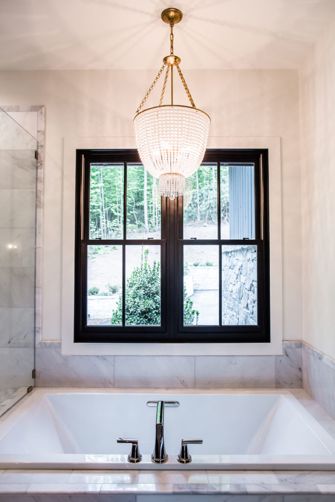 Black & Gold Accents in an All White Master Bathroom
