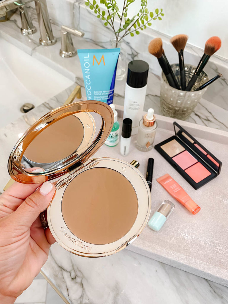 Charlotte Tilbury bronzer for faking a tan on your face. 