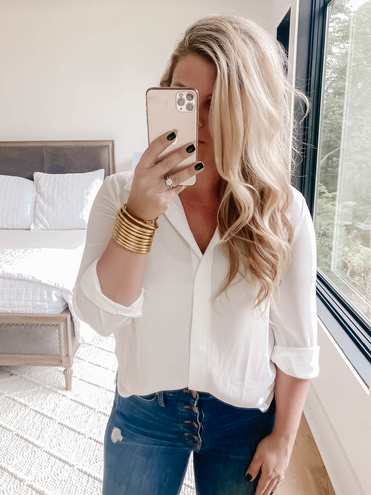 Cristin Cooper in Flowy white shirt and button front skinny jeans